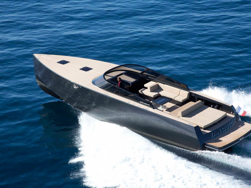 new yacht van dutch with black surface sailing in ibiza waters