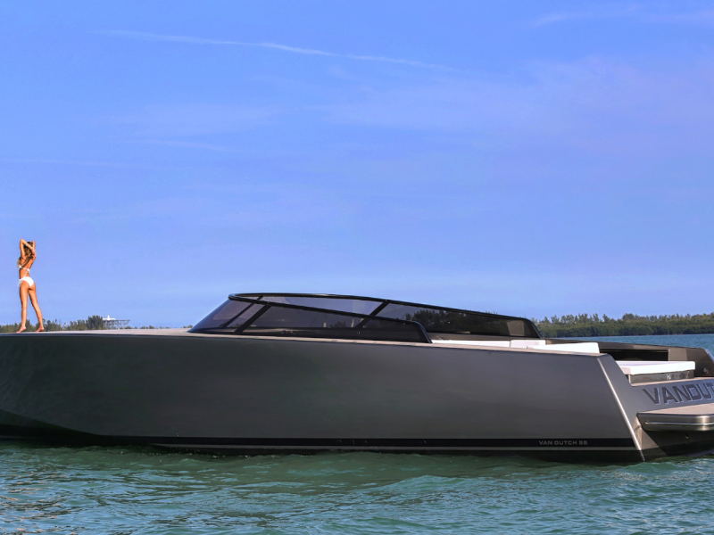 a woman on top of the deck of the van dutch 40